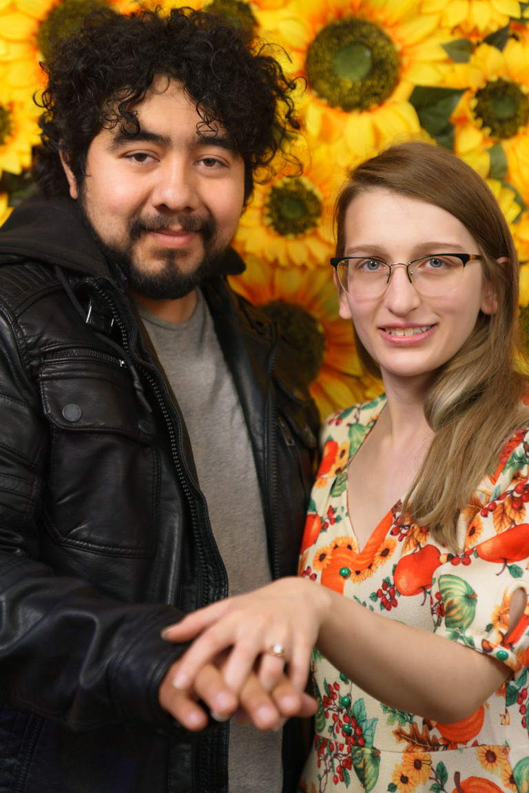 couple with sunflower background