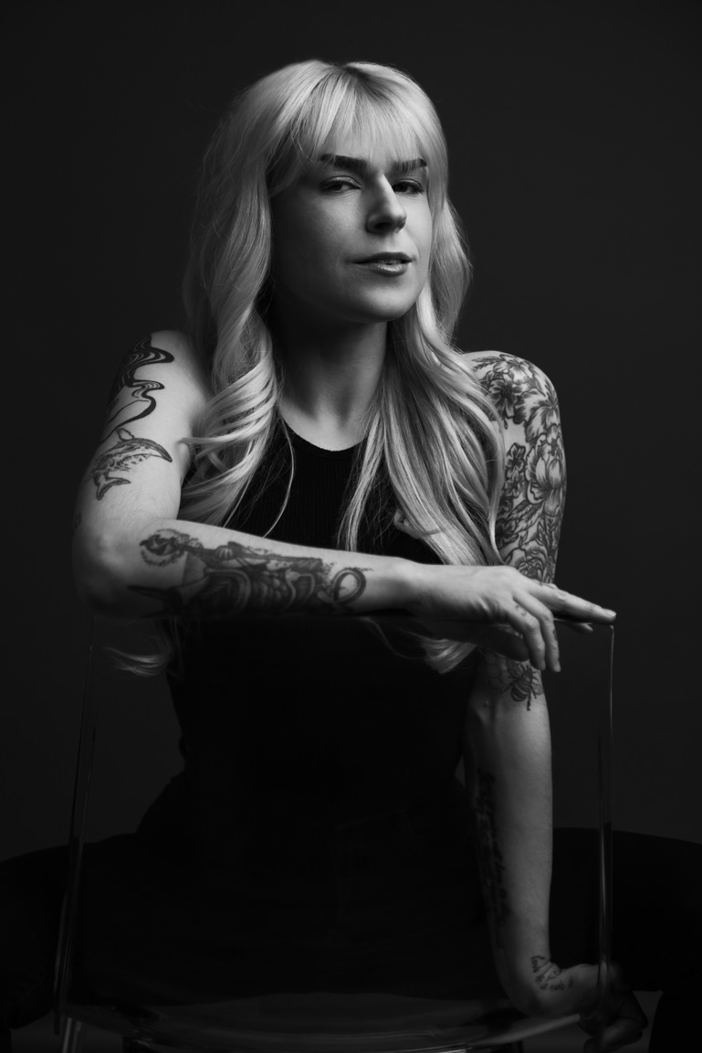 woman sitting on chair headshot