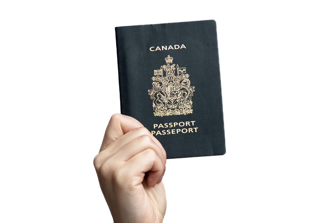 hand holding passport photo